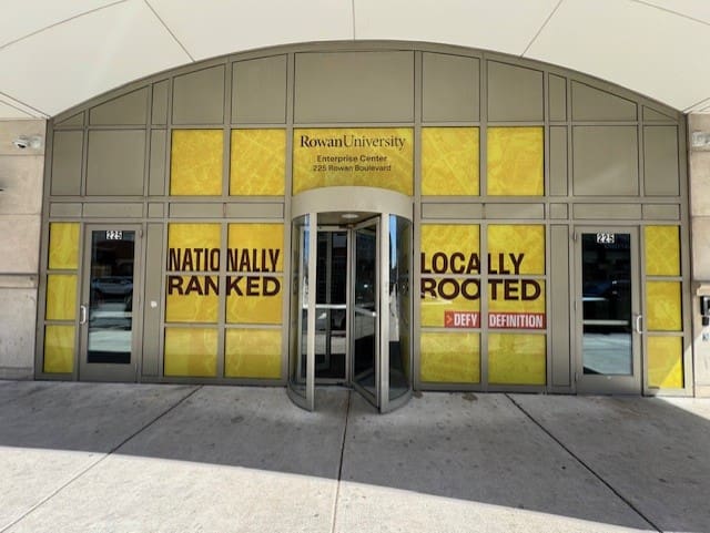 Rowan University entrance with bold yellow signage.