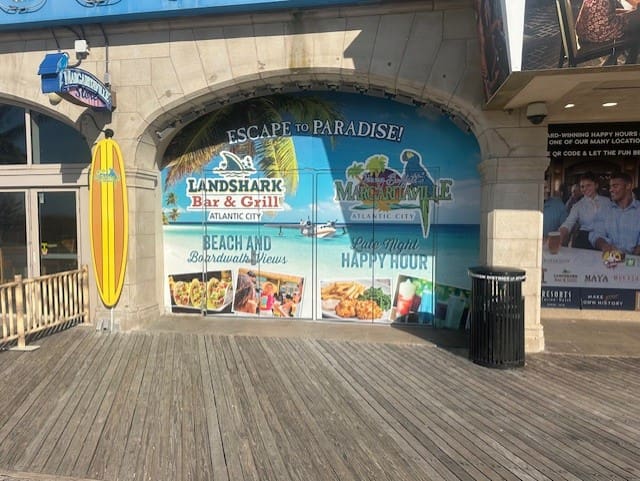 Beach-themed bar and grill entrance signage.