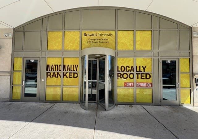 Rowan University entrance with bold yellow signage.