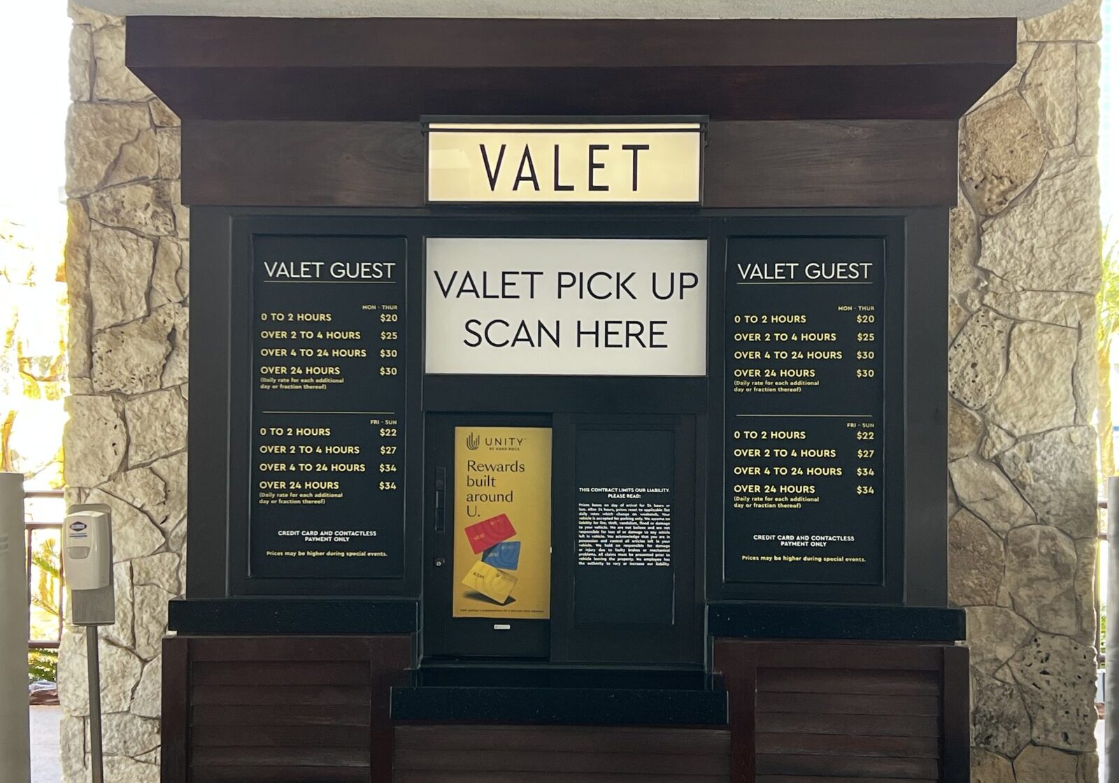 Valet service station with instructions and menu boards.