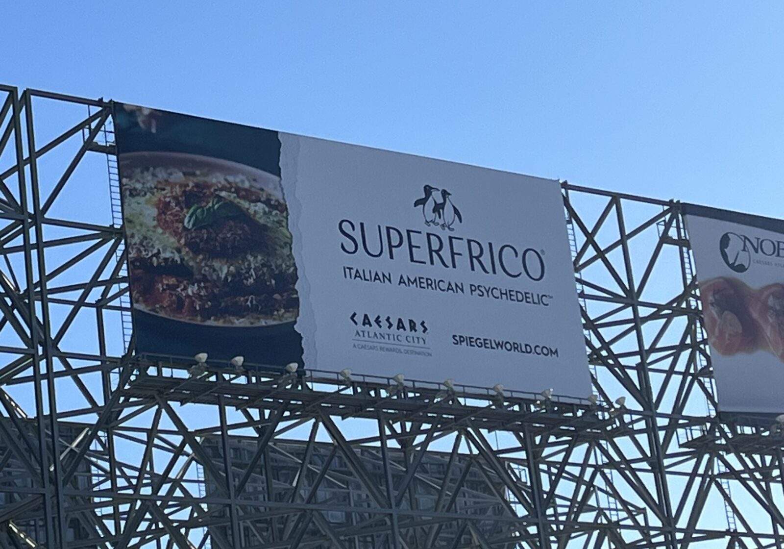 Billboard advertising Superfrico Italian-style fried chicken.